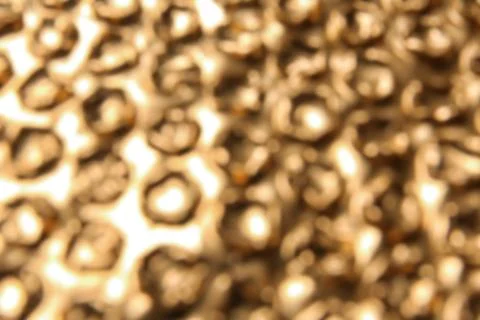 Blurred view of golden bubble wrap as background Stock Photos