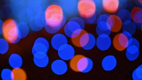 Blurred view of the lights flaring at the dark backdrop. Close up. Garland Stock Footage 316553764