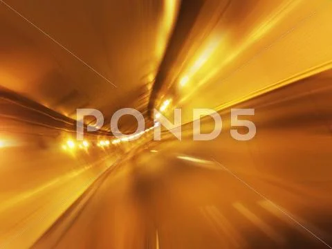Blurred view of lit tunnel Stock Photos