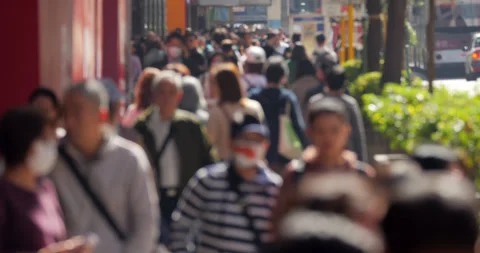 Blurred view, local people walking on Nathan Road sidewalk in Hong Kong Stock Footage 309399962