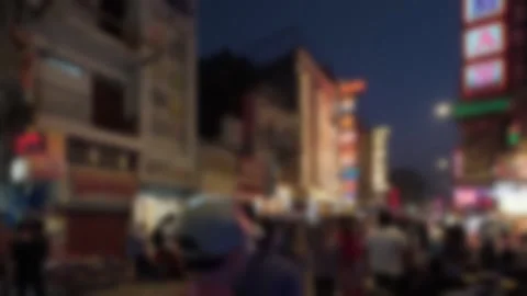 Blurred view of the Main Bazar road with buzy evening traffic in Delhi, India Stock Footage 300081966