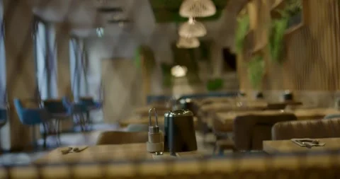 Blurred View Into Modern Restaurant With Pendant Lights Видео 340279477