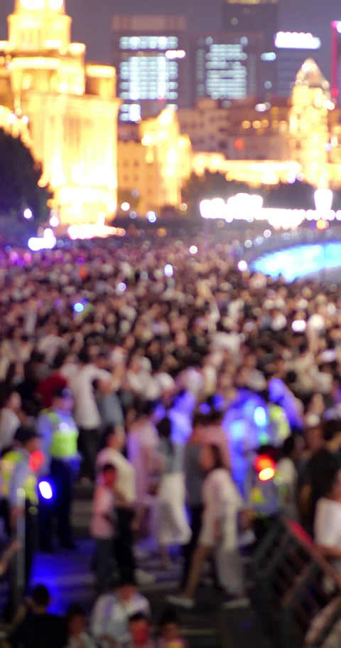 Blurred view of overcrowded Huangpu River embankment at night Video stock 327649567