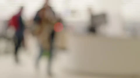 Blurred view of passengers passing by toward their gate after luggage securi 스톡 동영상 309061891