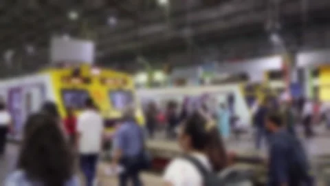 Blurred view of the passengers walking at Chhatrapati Shivaji Maharaj Terminus Stock Footage 300040893