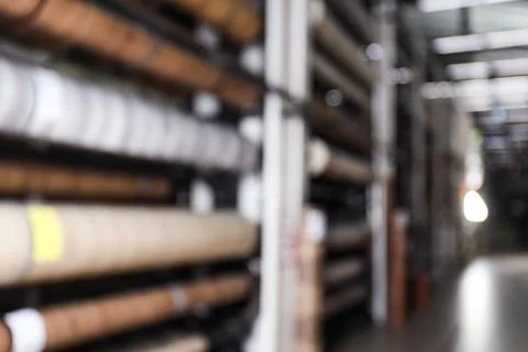 Blurred view of storage stands with different building materials in wholesale Fotos de archivo