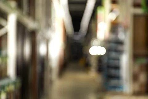 Blurred view of storage stands with different building materials in wholesale Fotos de archivo