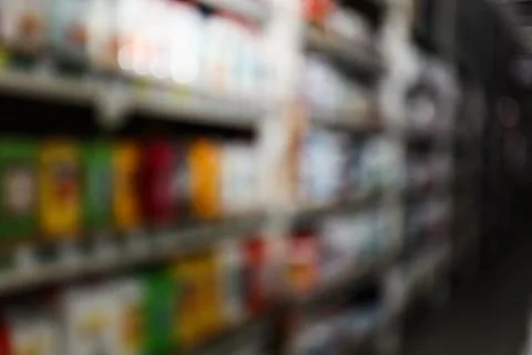 Blurred view of storage stands with different building materials in wholesale Fotos de archivo