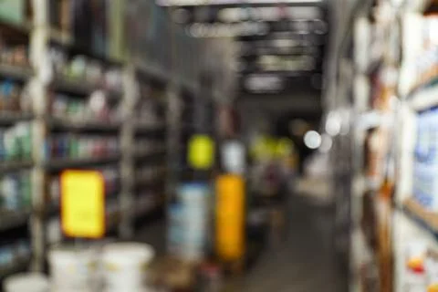 Blurred view of storage stands with different building materials in wholesale Fotos de archivo