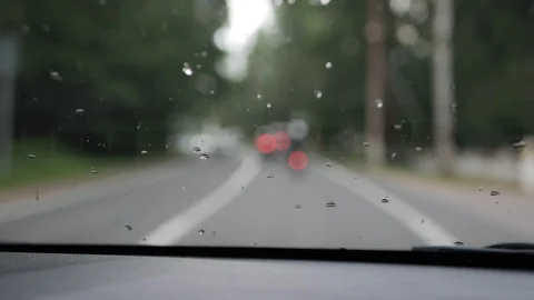 Blurred view through the front window of the car. The car goes on a country road Video stock 101785339