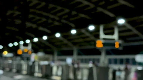Blurred view of a train station platform with glowing lights and a dark cei.. Stock-Footage 339368867
