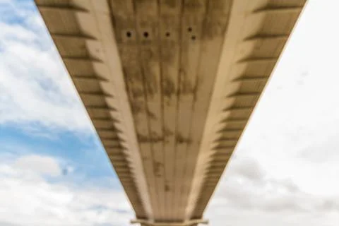 Blurred view Underside of large road suspension bridge, landscape Stock Photos