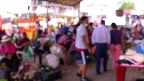 A blurred view of an unrecognisable crowd of people walking at a street market Stock Footage 153720804
