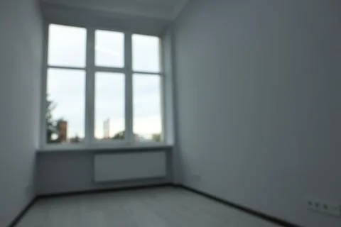 Blurred view of window in empty renovated room Stock Photos
