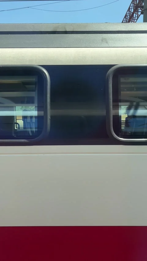 Blurred view from window of white and red Georgian high speed train with cross Stock Footage 280488704