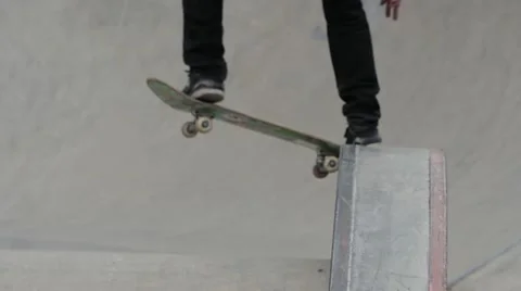 Blurred view of a young man jumping from the ledge in skate park Stock Footage 63505327
