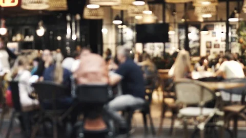 Blurred the waitress comes to the table and gives the visitors a menu Stock Footage 100734853