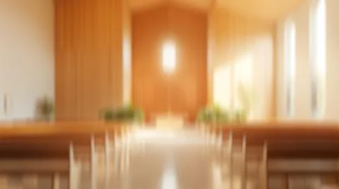 Blurred warm interior like a chapel or ceremony hall with glowing cross and.. Stock Photos