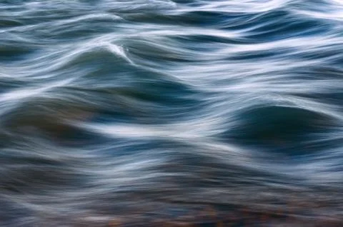 Blurred Waves over Riverbed or Seabed. Stock Photos