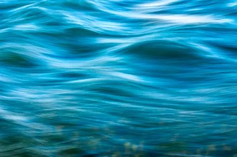 Blurred Waves over Riverbed or Seabed. Stock Photos