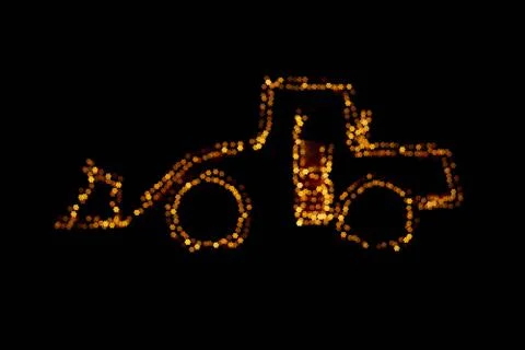 Blurred wheel loader decorated with lights Stock Photos