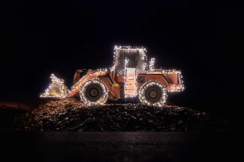 Blurred wheel loader decorated with lights Stock Photos