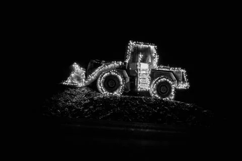 Blurred wheel loader decorated with lights Stock Photos