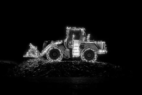 Blurred wheel loader decorated with lights 库存照片