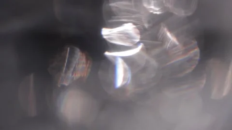 Blurred white background of crystal sparkling prism lights superimposed Видео 318775635