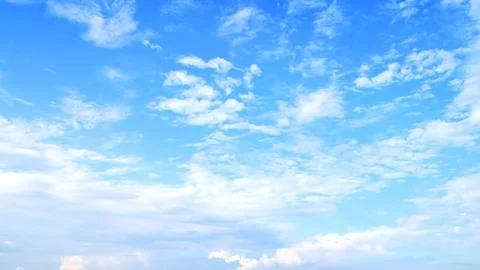 Blurred white clouds on the sky background. Stock Photos
