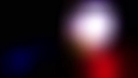 A blurred white lantern and a flashing police siren on a black background.  Stock Footage 237335990