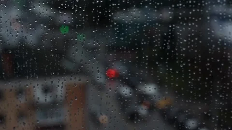 Blurred window view of the city on a rainy day. Stock Footage 167679497