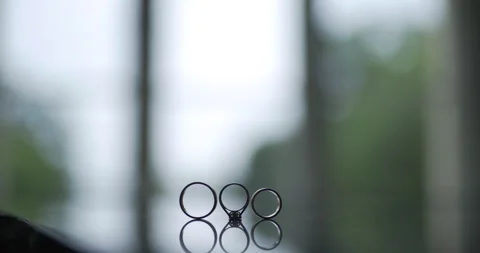 Blurred window view with small metal rings and daylight Vídeo Stock 336470710