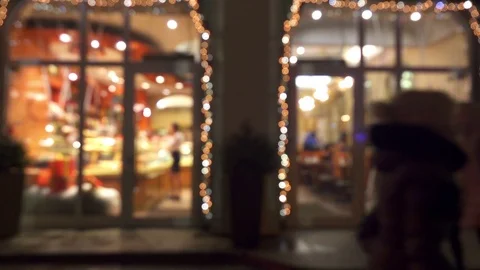 Blurred windows of coffee house with glowing lights. Stock Footage 70874725