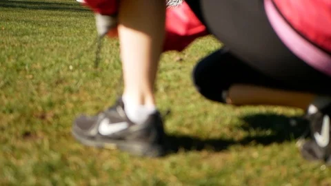 Blurred young lady binds her shoe and starts run 스톡 동영상 104097621