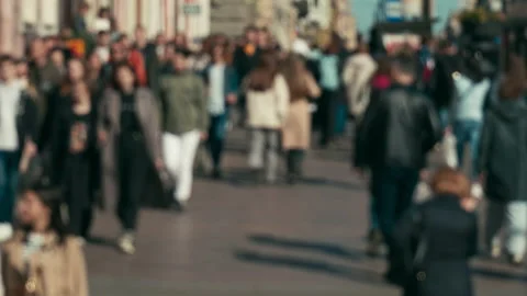 Blurring, anonymous people walking down a city street, a crowd of people Stock Footage 195115077