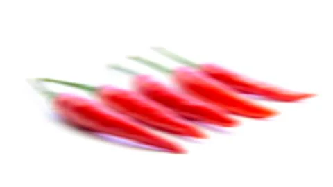 Blurring red chili pepper movement Stock Photos