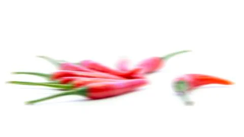 Blurring red chili pepper with single on white background Stock Photos