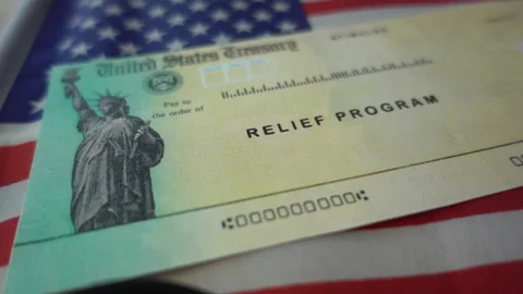 Blurring Stimulus check  relief program on Flag of USA, close up view. Stock Footage 145771123