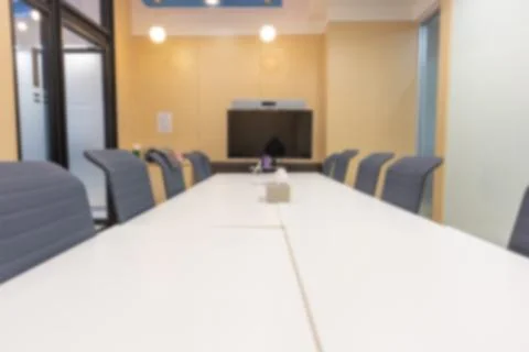 Blurry abstract background of empty modern boardroom, meeting office room Stock Photos