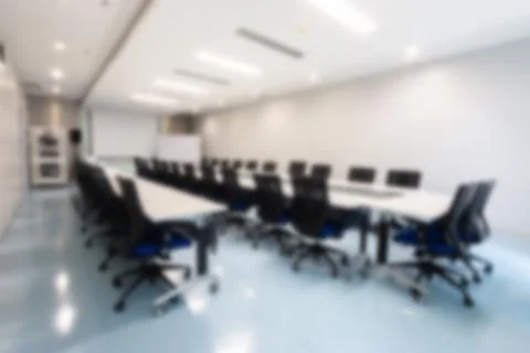Blurry abstract background of empty modern boardroom, meeting office room Stock Photos
