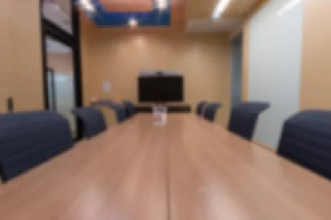 Blurry abstract background of empty modern boardroom, meeting office room Stock Photos