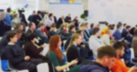 Blurry audience and speaker interaction at busy conference Stock Footage 301082070