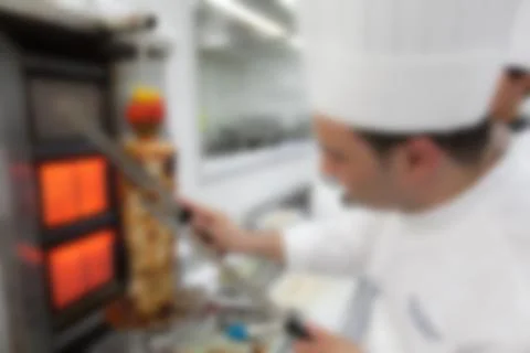 Blurry background of Chef in hotel or restaurant kitchen cooking for dinner p Stock Photos