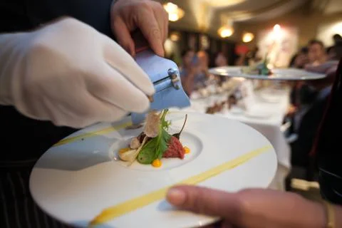 Blurry background of chef slide Truffle mushroom put on top food on dinner pa Stock Photos