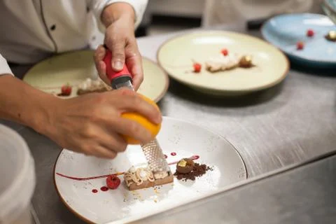 Blurry background, Dessert with chef slide orange peel on top in the restaura Stock Photos