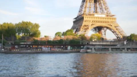 Blurry background of Eiffel Tower visible across River Seine in Paris, France Fotos de archivo