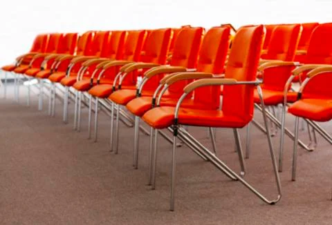 Blurry background image of row red office chairs Stock Photos