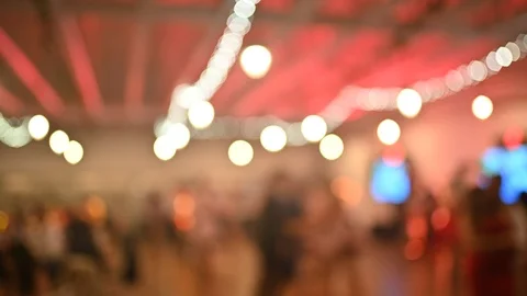 Blurry Background Party Show with Crowd Dancing in front Stock Footage 116588409