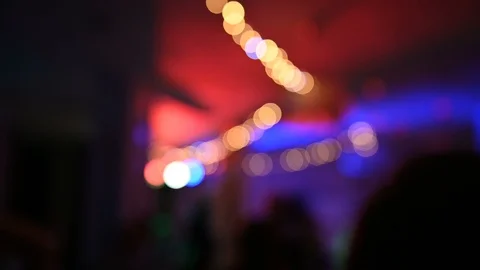 Blurry Background Party Show with Crowd Dancing in front Stock Footage 122279458
